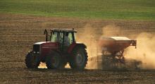 Tractor applying fertiliser