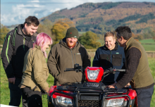 Image of farm workforce smiling in the field